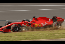 In a severe F1 collision, Zhou Guanyu's car flips over a tyre barrier.