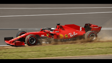 In a severe F1 collision, Zhou Guanyu's car flips over a tyre barrier.